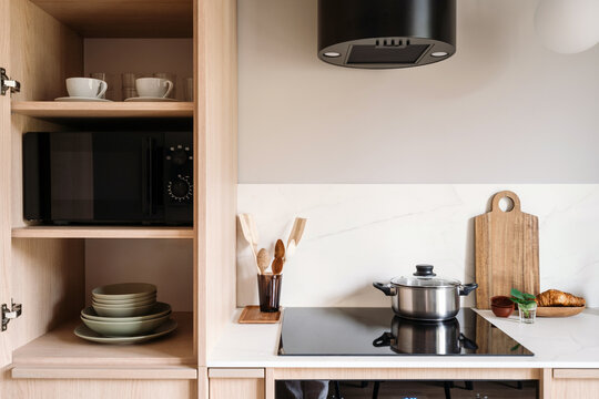 Modern kitchen with integrated microwave and induction stove