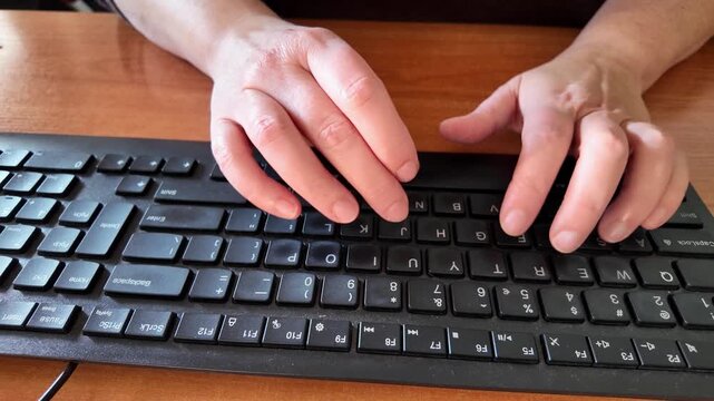 Timelapse of female hands typing fast on computer keyboard. Cinematic 4K stock footage for office, coding, and remote work b-roll