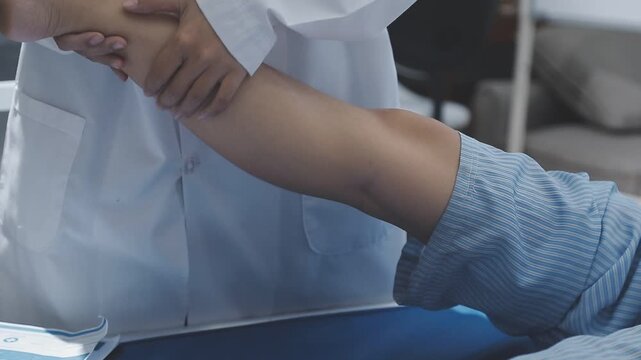 Skilled physical therapist meticulously examining a patient's leg and knee joint, focusing on rehabilitation and health