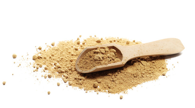 Ginger powder pile with wooden spoon isolated on white background