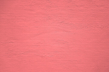 Fototapeta premium pink violet red stucco wall texture, peach fuzz color background. Abstract artistic backdrop for design. color, pastel orange plaster, exterior wall building texture pattern