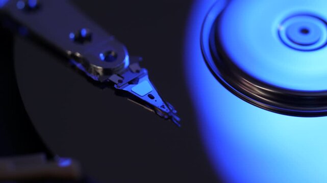 Cyberspace Protection of Personal Data on HDD. Macro Close Up Footage of Head of Hard Disk that Reads Information From Media. Computer Hard Drive Working Open With Moving Head.
