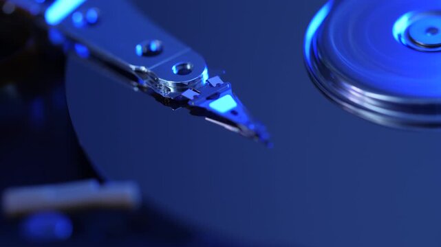 Cyberspace Protection of Personal Data on HDD. Macro Close Up Footage of Head of Hard Disk that Reads Information From Media. Computer Hard Drive Working Open With Moving Head.