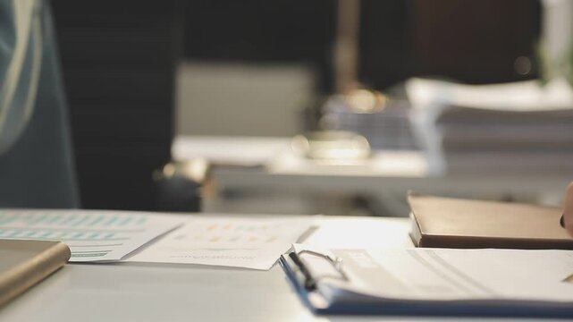 Auditor and accountant working in office Analyze financial data and accounting records with a calculator. Accounting companies provide financial and tax planning services. Close-up pictures