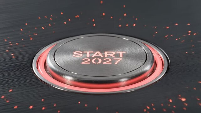 Macro view of a finger pushing a metallic Start 2027 button with glowing red light and sparks