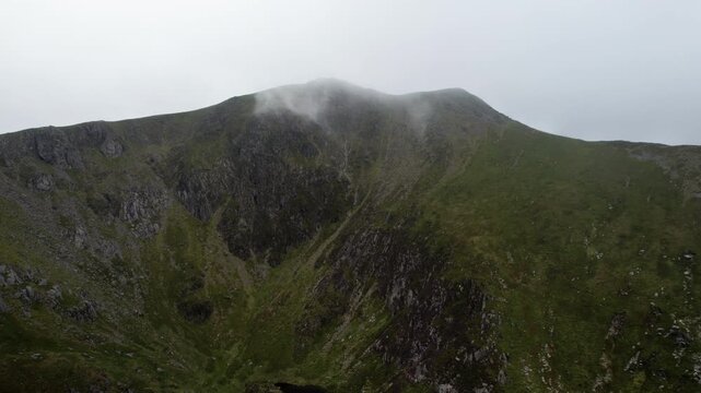 Aerial Drone View of Misty Mountain Summit and Remote Tarn in Snowdonia