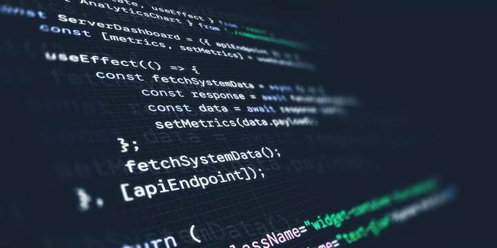 Close up of a computer screen displaying modern React JavaScript programming code with syntax highlighting