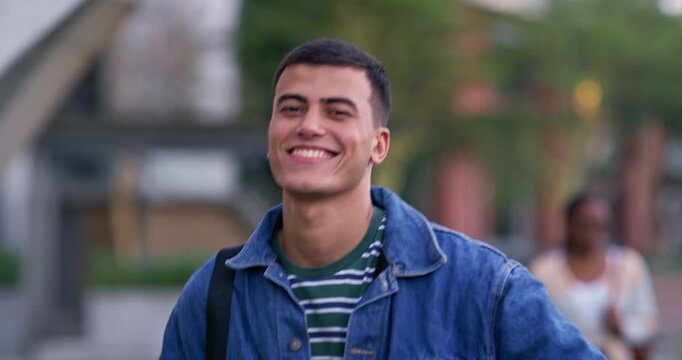 Thumbs up, man and happy on campus for education, knowledge and pride for scholarship. Academic, portrait and hand gesture in university for approval, learning and walk to lecture in Australia