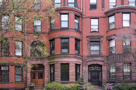 Old brownstone style apartment buildings with bow windows