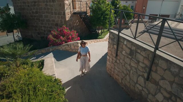 Woman Traveling Through an Old Spanish Village, Enjoying the Historic Architecture and Mountain Views in Peal De Becerro