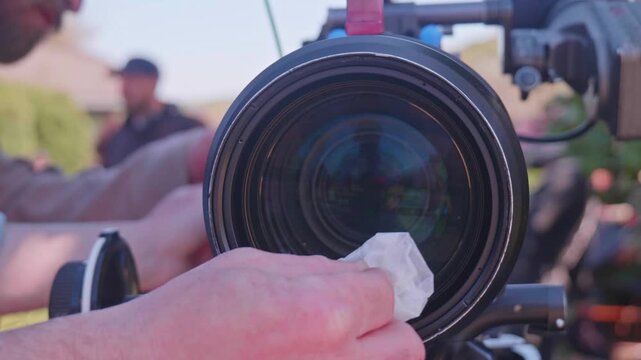 Cleaning Professional Cinema Camera Lens with Lens Tissue