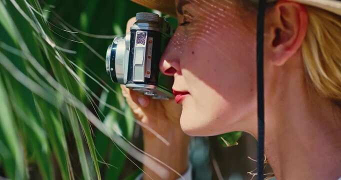 Woman Taking Photos with Vintage Camera in Nature