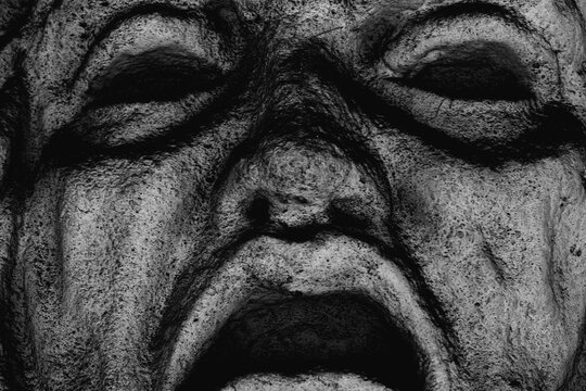 Stone face of Phobos, ancient embodiment of fear and terror in Greek mythology