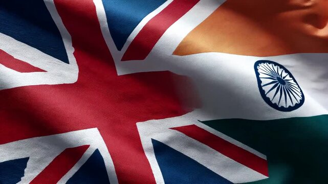 british flag waving next to indian flag. relations great britain and india
