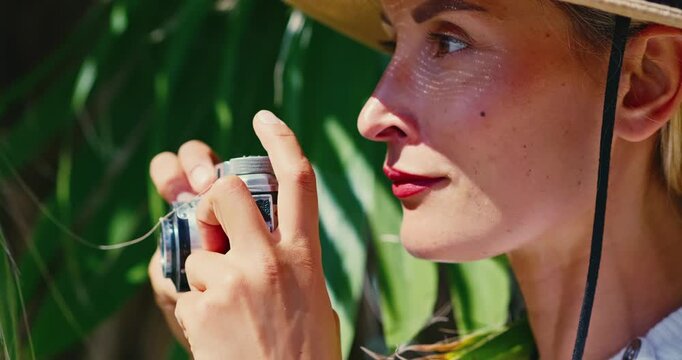 Woman Observing with Monocular in Tropical Setting