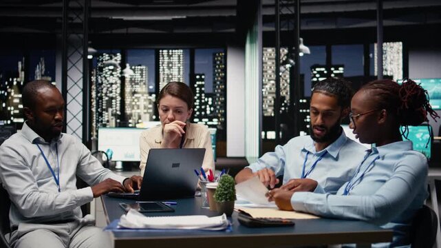 Office employees doing business meeting to plan project with reports, trying to meet objectives and deadline. Group of colleagues doing research and documenting forecast, action plan.