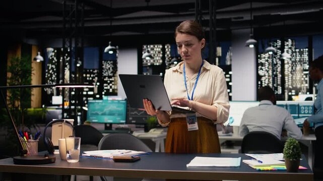 Portrait of smiling office employee managing schedules on laptop, organizing calendar appointments and meetings. Happy woman compiling computerized company information records on notebook.