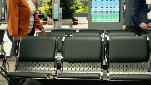 Busy bus station with travelers waiting for express and sleeper bus routes. Multicultural passengers with baggage sitting in waiting area before long-distance interstate journey.