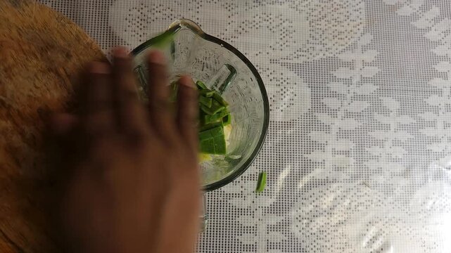Adding Green Nopal Cactus Pieces Into Blender With Apple And Banana