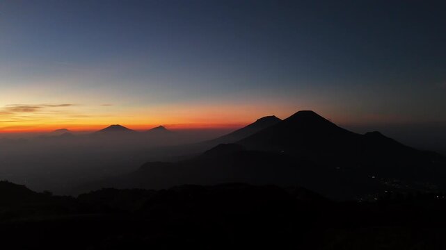 Aerial footage of the morning sun sky with views of Mount Sumbing and Sindoro.