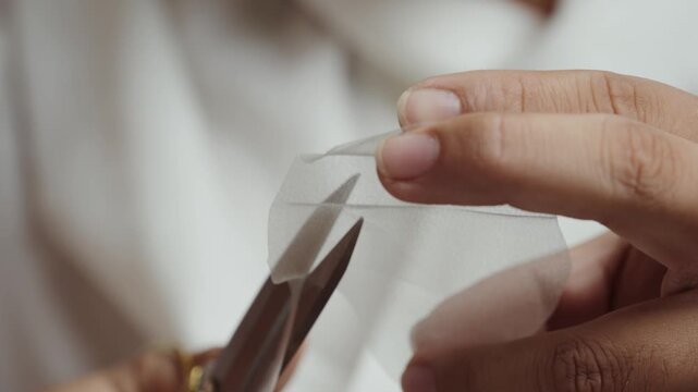 Trimming sheer textile petal for handcrafted bridal flower and couture embellishment