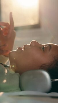 Relax, child and singing with headphones on bed for pop soundtrack, album release or memorize song. Laugh, girl kid and listening to music in home for viral sound, learning lyrics and weekend break