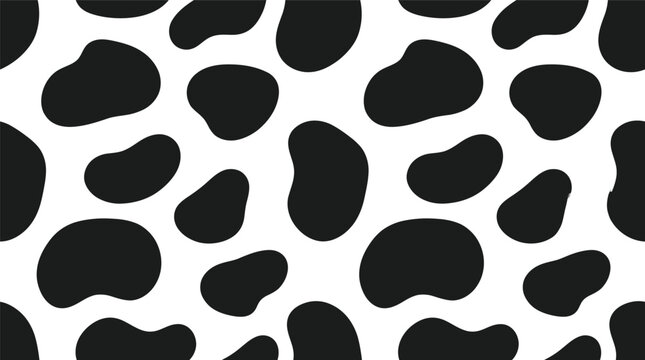 Seamless black and white cowhide pattern texture background for design.