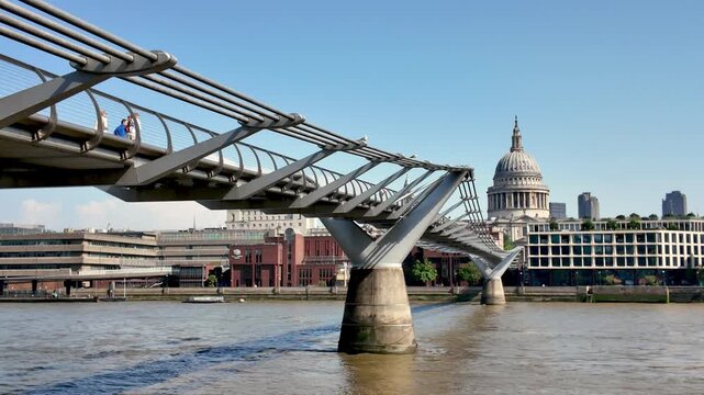 The Millennium bridge and St Paul's Cathedral seen across the river