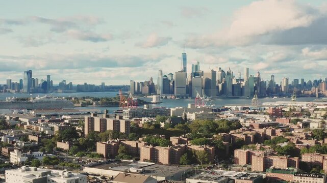 Stunning aerial shot of lower Manhattan skyline over red hook Brooklyn at sunset.