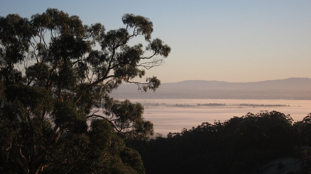 Golden dawn over countryside with Mount Baw Baw backdrop