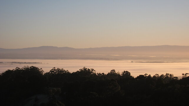 Golden dawn over countryside with Mount Baw Baw backdrop