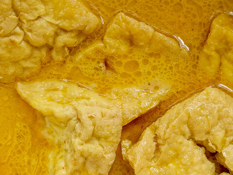 Delicious Tahu Opor, Indonesian fried tofu simmered in rich coconut milk and turmeric broth