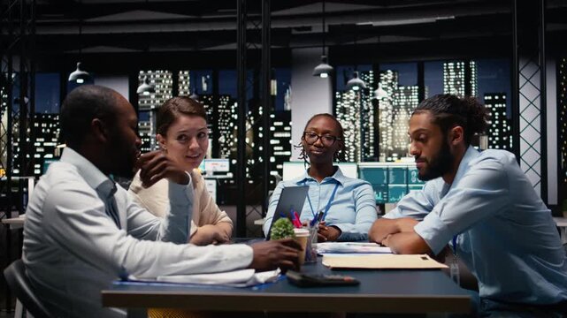 African american woman worried about lack of progress during meeting with colleagues, feeling burnout and stress. Working overtime to study business intel, frustration and low energy.