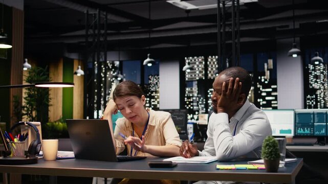Diverse workers team being exhausted and disappointed with missing deadline, stressed and worried people struggling to finish tasks with low energy and no motivation. Poor results.