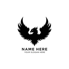 Fototapeta premium A dramatic eagle logo with wings spread wide on a white background for branding