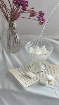 Still Life with Purple Dried Flowers and Vintage Book Pages