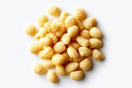 Ridged corn puff snacks arranged in a pile on a white background in a clean top-down shot for snack food advertising and retail packaging design