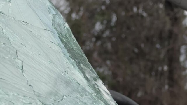 Damaged front windshield glass on smashed car 4k