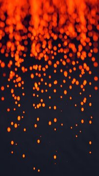Abstract glow of orange sparks resembling fire or molten lava particles.
