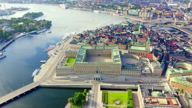 Stockholm, Sweden. The Royal Palace, a vast Baroque complex with copper-green roofs and sandstone walls, Drone footage over Gamla Stan and surrounding waterways. Drone footage, Point of interest