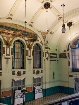 Interior view of Vitebsk railway station in Saint Petersburg. The architecture features high ceilings, large windows, and decorative elements in a historical style.