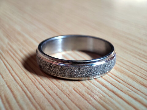 wedding textured silver rings on a table