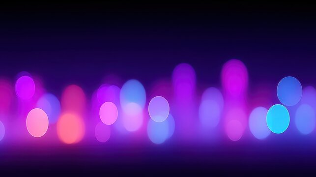A vibrant blur of colorful lights in shades of blue, pink, and purple.
