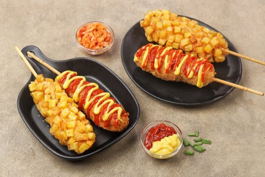 Corn dog is a food made from skewered sausages (usually hot dogs) coated in a thick layer of cornmeal and fried.
