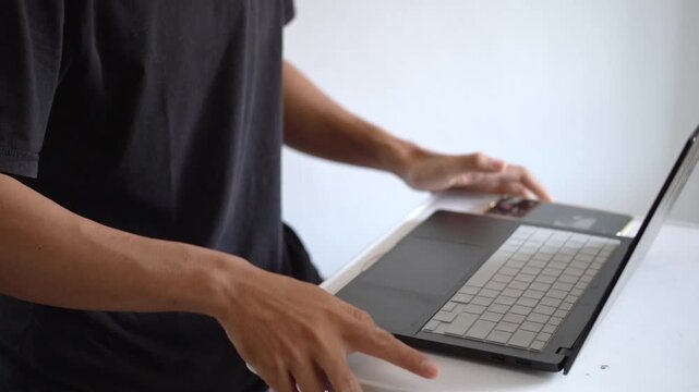 Close Up View of Frustrated Man Showing Angry Gesture and Hitting Table While Working on Laptop