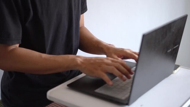 Close Up View of Man Hands Typing on Laptop Keyboard on White Table During Work Session