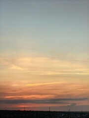 Obraz premium Soft Pastel Sunset Sky Above Quiet Horizon