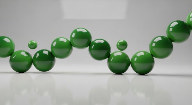 Green spheres on a clean, reflective surface