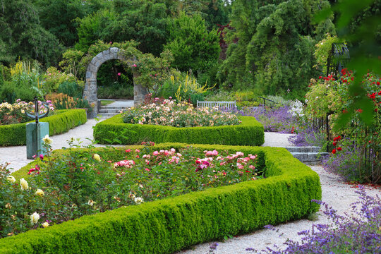 Queen Elizabeth park and gardens with stone archway and path in Vancouver, Canada