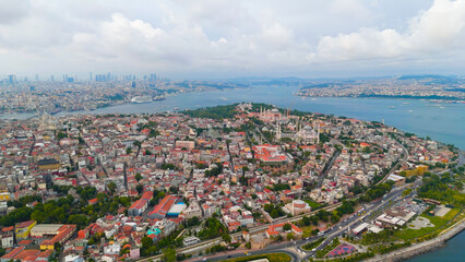 Obraz premium Istanbul, Turkey. Bosphorus embankment. Historical city center. Fatih district. Cloudy weather at sunset, Aerial View